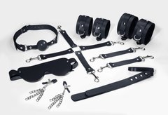 Набір Feral Feelings BDSM Kit 7 Black, наручники, поножі, конектор, маска, падл, кляп, затискачі SO8276 фото